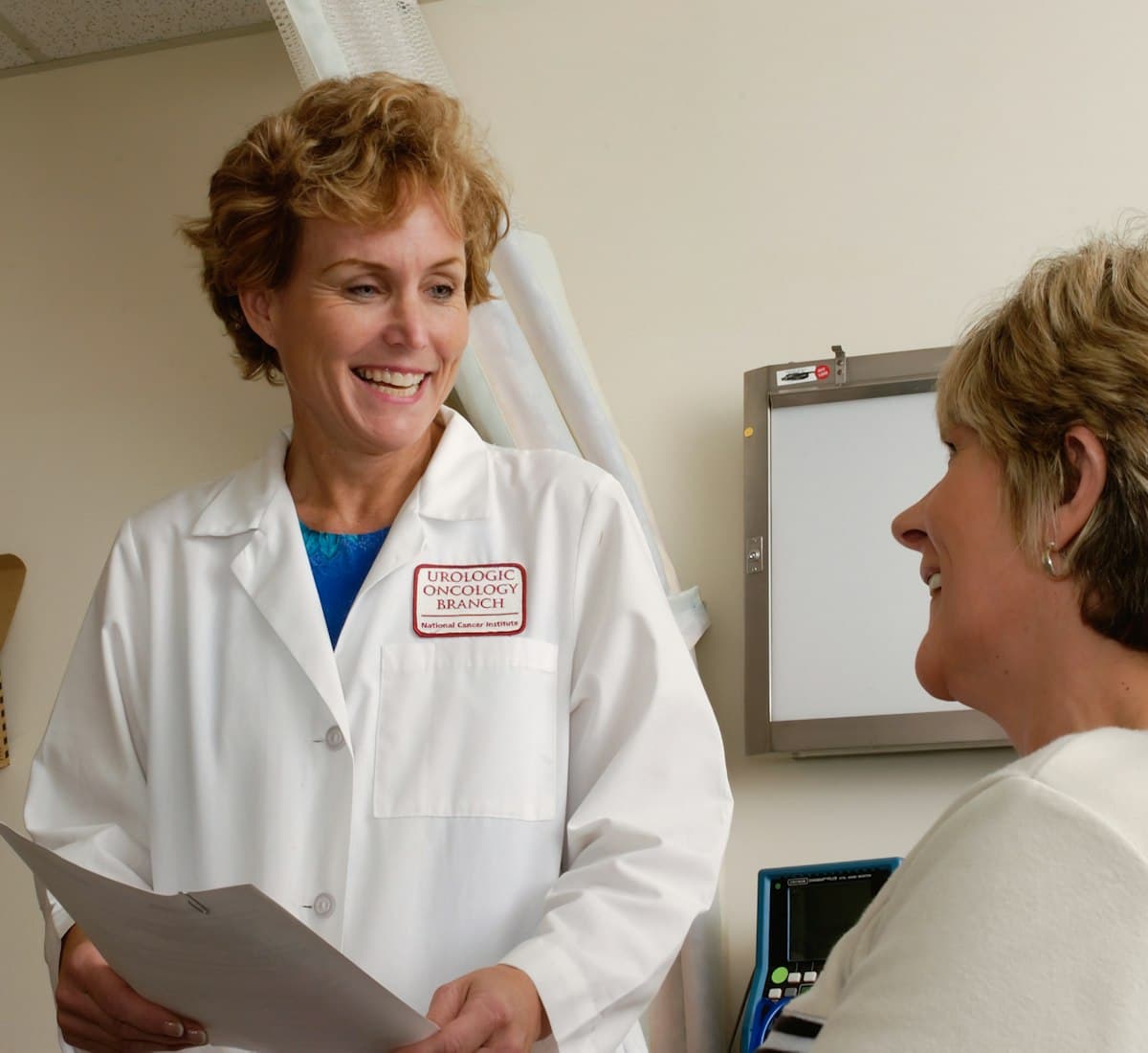 A homeopath consulting a patient